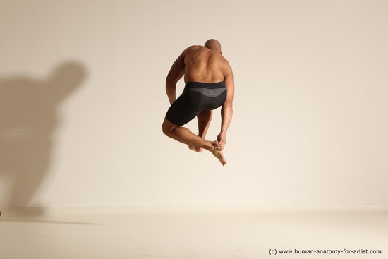 Underwear Gymnastic poses Man Black Muscular Bald Dancing Dynamic poses Academic