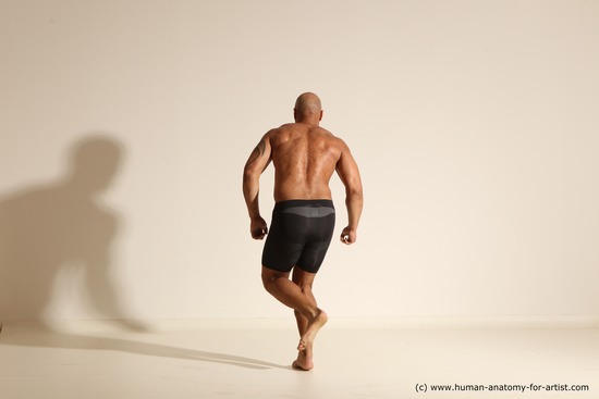 Underwear Gymnastic poses Man Black Muscular Bald Dancing Dynamic poses Academic