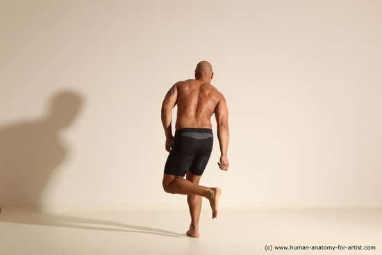 Underwear Gymnastic poses Man Black Muscular Bald Dancing Dynamic poses Academic