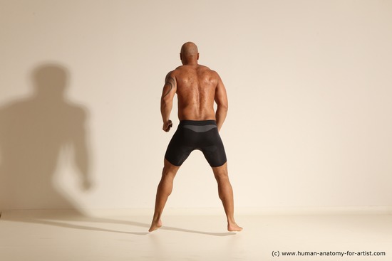 Underwear Gymnastic poses Man Black Muscular Bald Dancing Dynamic poses Academic