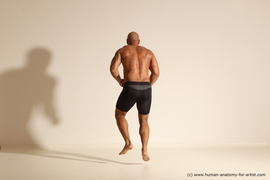 Underwear Gymnastic poses Man Black Muscular Bald Dancing Dynamic poses Academic