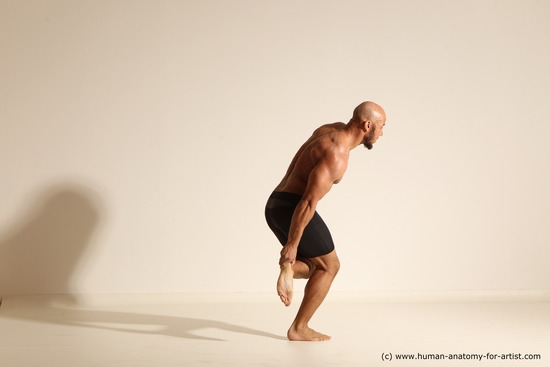 Underwear Gymnastic poses Man Black Muscular Bald Dancing Dynamic poses Academic