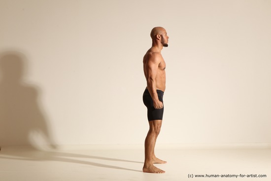 Underwear Gymnastic poses Man Black Muscular Bald Dancing Dynamic poses Academic