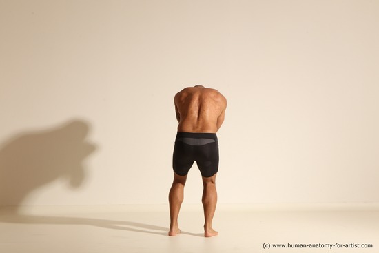 Underwear Gymnastic poses Man Black Muscular Bald Dancing Dynamic poses Academic