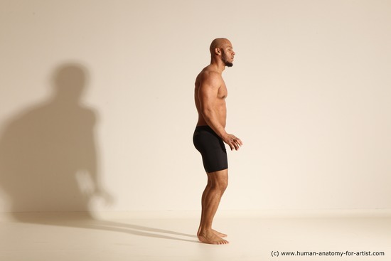 Underwear Gymnastic poses Man Black Muscular Bald Dancing Dynamic poses Academic