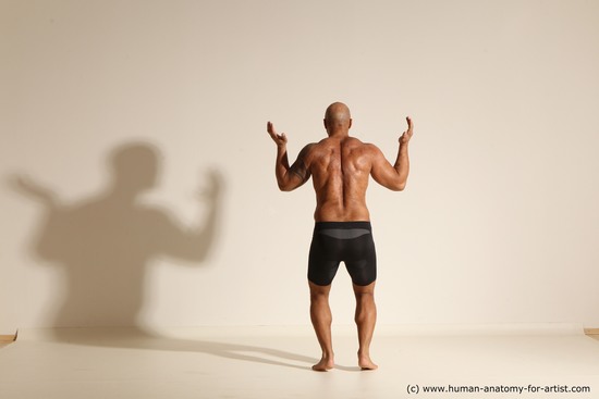 Underwear Gymnastic poses Man Black Muscular Bald Dancing Dynamic poses Academic