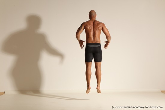 Underwear Gymnastic poses Man Black Muscular Bald Dancing Dynamic poses Academic