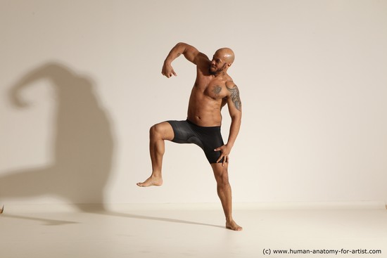 Underwear Gymnastic poses Man Black Muscular Bald Dancing Dynamic poses Academic