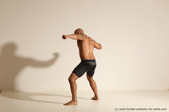 Underwear Gymnastic poses Man Black Muscular Bald Dancing Dynamic poses Academic