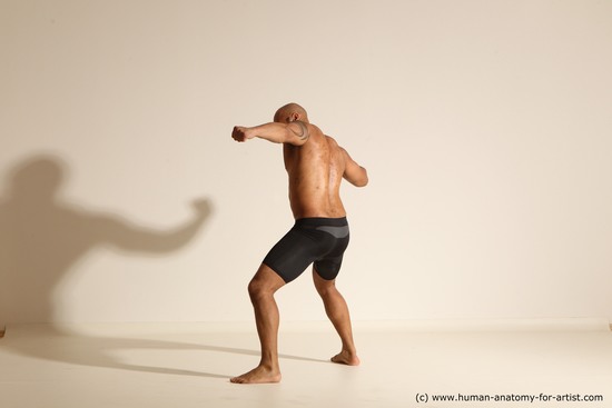 Underwear Gymnastic poses Man Black Muscular Bald Dancing Dynamic poses Academic