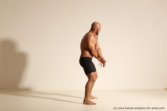 Underwear Gymnastic poses Man Black Muscular Bald Dancing Dynamic poses Academic