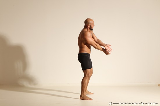 Underwear Gymnastic poses Man Black Muscular Bald Dancing Dynamic poses Academic