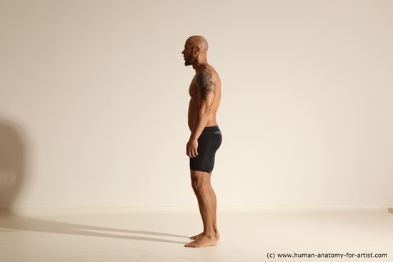 Underwear Gymnastic poses Man Black Muscular Bald Dancing Dynamic poses Academic