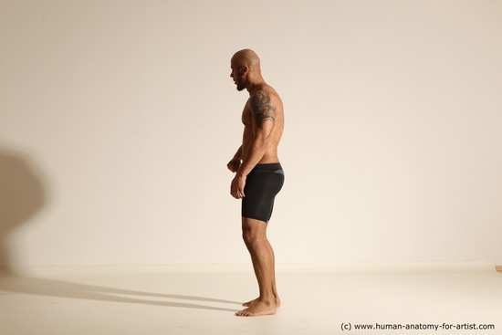 Underwear Gymnastic poses Man Black Muscular Bald Dancing Dynamic poses Academic