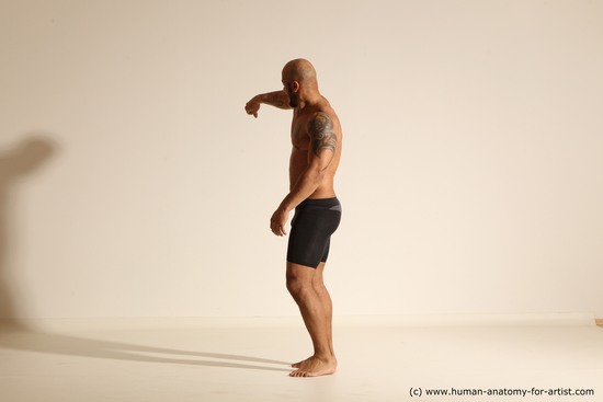 Underwear Gymnastic poses Man Black Muscular Bald Dancing Dynamic poses Academic