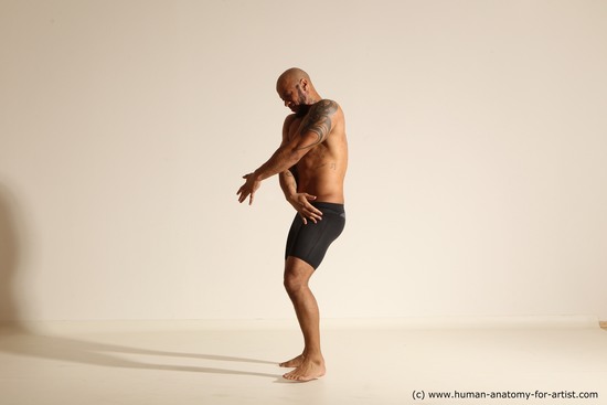 Underwear Gymnastic poses Man Black Muscular Bald Dancing Dynamic poses Academic