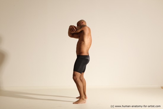 Underwear Gymnastic poses Man Black Muscular Bald Dancing Dynamic poses Academic