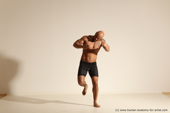 Underwear Gymnastic poses Man Black Muscular Bald Dancing Dynamic poses Academic