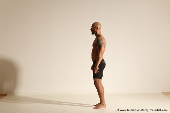 Underwear Gymnastic poses Man Black Muscular Bald Dancing Dynamic poses Academic