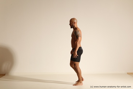 Underwear Gymnastic poses Man Black Muscular Bald Dancing Dynamic poses Academic