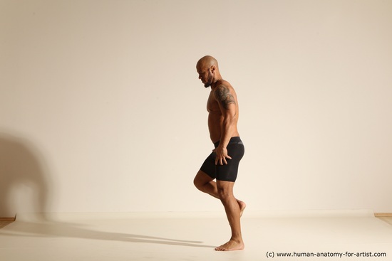 Underwear Gymnastic poses Man Black Muscular Bald Dancing Dynamic poses Academic