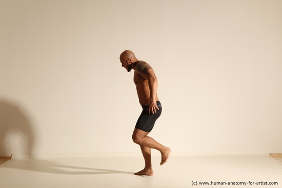 Underwear Gymnastic poses Man Black Muscular Bald Dancing Dynamic poses Academic