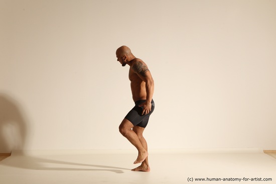 Underwear Gymnastic poses Man Black Muscular Bald Dancing Dynamic poses Academic