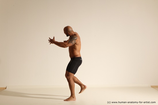 Underwear Gymnastic poses Man Black Muscular Bald Dancing Dynamic poses Academic