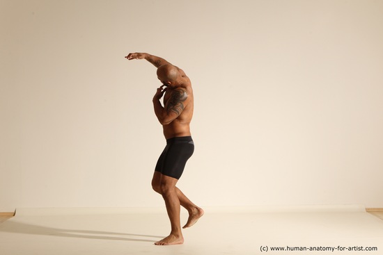 Underwear Gymnastic poses Man Black Muscular Bald Dancing Dynamic poses Academic