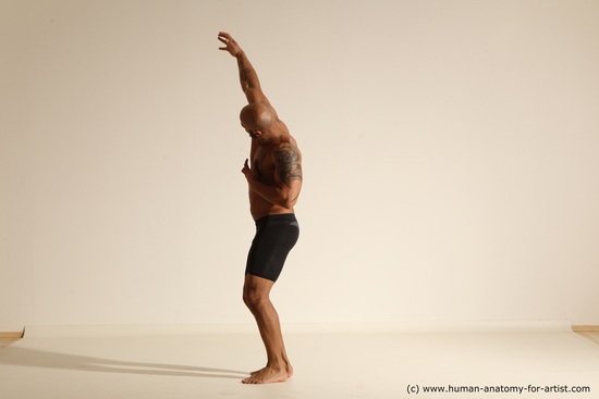 Underwear Gymnastic poses Man Black Muscular Bald Dancing Dynamic poses Academic