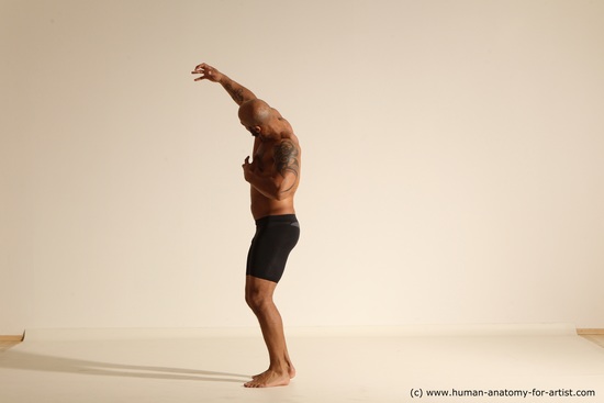 Underwear Gymnastic poses Man Black Muscular Bald Dancing Dynamic poses Academic