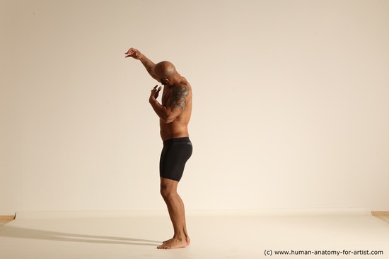 Underwear Gymnastic poses Man Black Muscular Bald Dancing Dynamic poses Academic