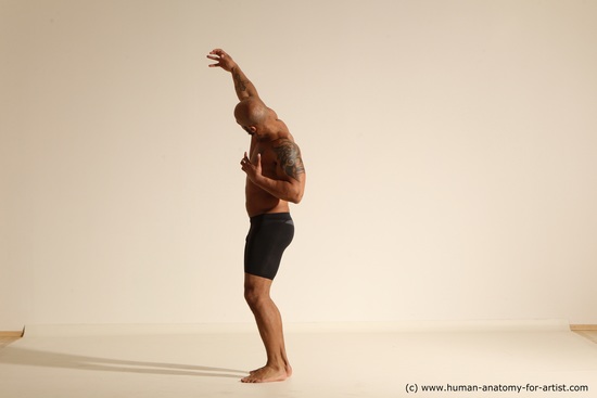 Underwear Gymnastic poses Man Black Muscular Bald Dancing Dynamic poses Academic