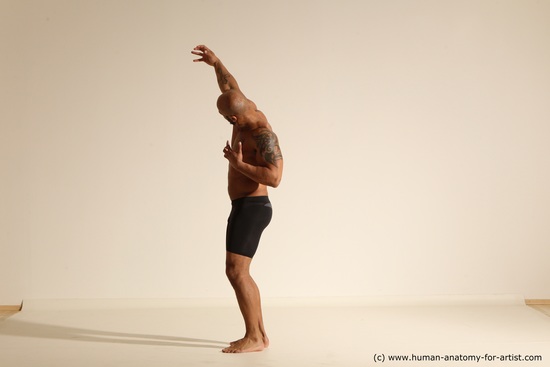 Underwear Gymnastic poses Man Black Muscular Bald Dancing Dynamic poses Academic