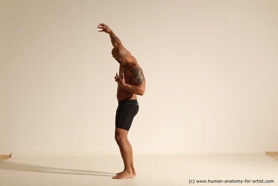 Underwear Gymnastic poses Man Black Muscular Bald Dancing Dynamic poses Academic