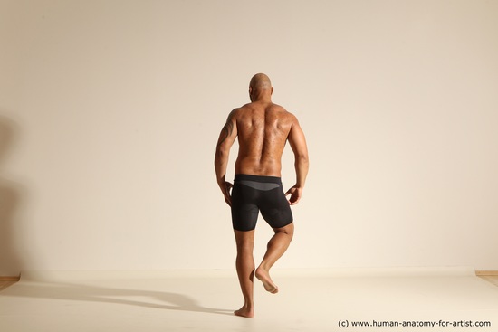 Underwear Gymnastic poses Man Black Muscular Bald Dancing Dynamic poses Academic