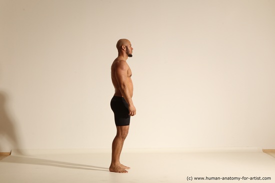 Underwear Gymnastic poses Man Black Muscular Bald Dancing Dynamic poses Academic