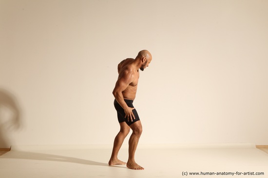 Underwear Gymnastic poses Man Black Muscular Bald Dancing Dynamic poses Academic