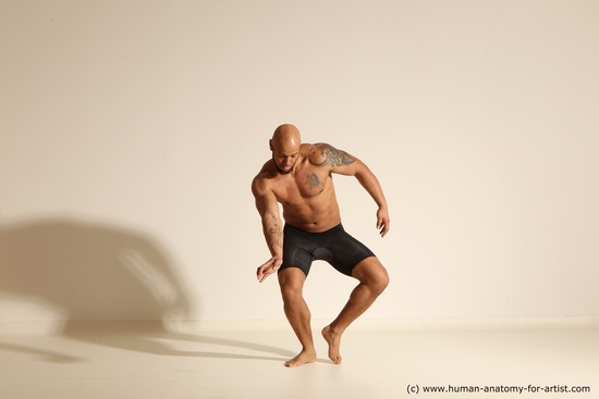 Underwear Gymnastic poses Man Black Muscular Bald Dancing Dynamic poses Academic