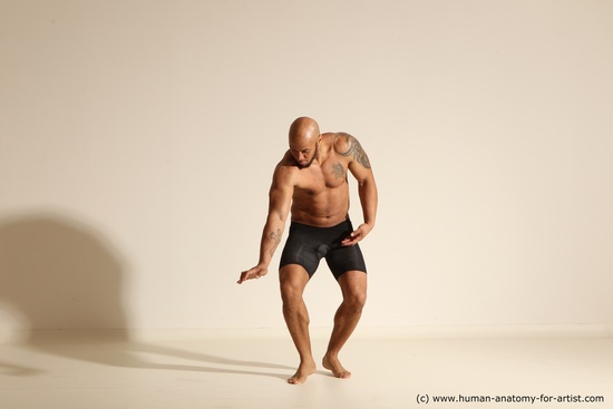 Underwear Gymnastic poses Man Black Muscular Bald Dancing Dynamic poses Academic