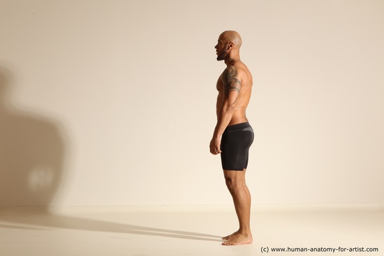 Underwear Gymnastic poses Man Black Muscular Bald Dancing Dynamic poses Academic