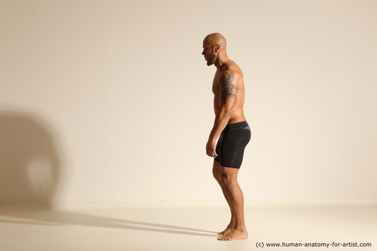 Underwear Gymnastic poses Man Black Muscular Bald Dancing Dynamic poses Academic