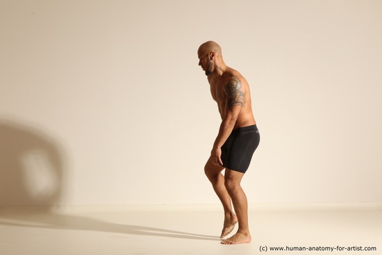 Underwear Gymnastic poses Man Black Muscular Bald Dancing Dynamic poses Academic