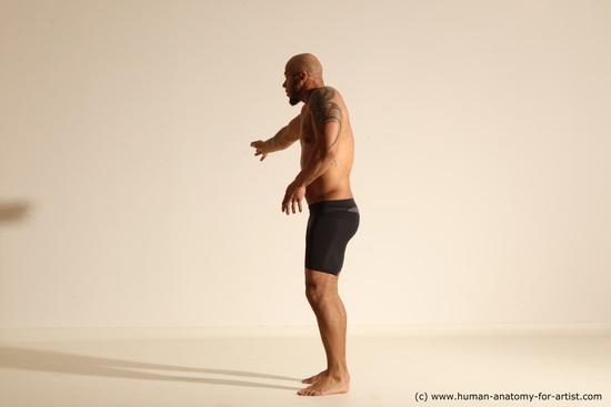 Underwear Gymnastic poses Man Black Muscular Bald Dancing Dynamic poses Academic