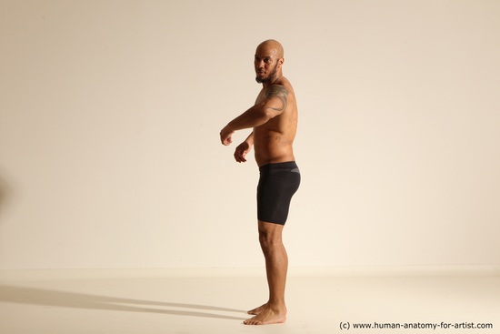 Underwear Gymnastic poses Man Black Muscular Bald Dancing Dynamic poses Academic