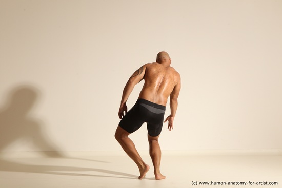 Underwear Gymnastic poses Man Black Muscular Bald Dancing Dynamic poses Academic