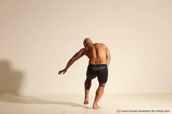 Underwear Gymnastic poses Man Black Muscular Bald Dancing Dynamic poses Academic