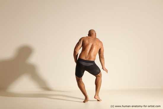 Underwear Gymnastic poses Man Black Muscular Bald Dancing Dynamic poses Academic