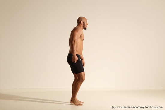 Underwear Gymnastic poses Man Black Muscular Bald Dancing Dynamic poses Academic