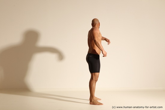 Underwear Gymnastic poses Man Black Muscular Bald Dancing Dynamic poses Academic